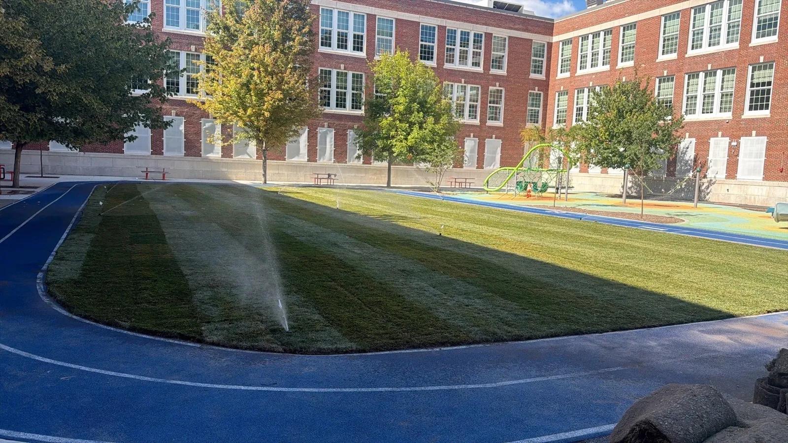 Commercial sod installation on a school field in Boston, MA
