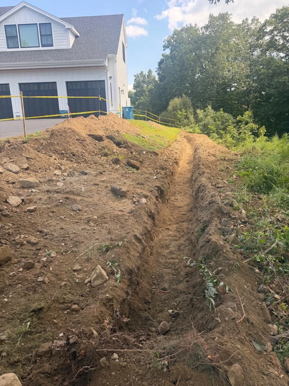 Drainage trench excavated into a hillside in Massachusetts