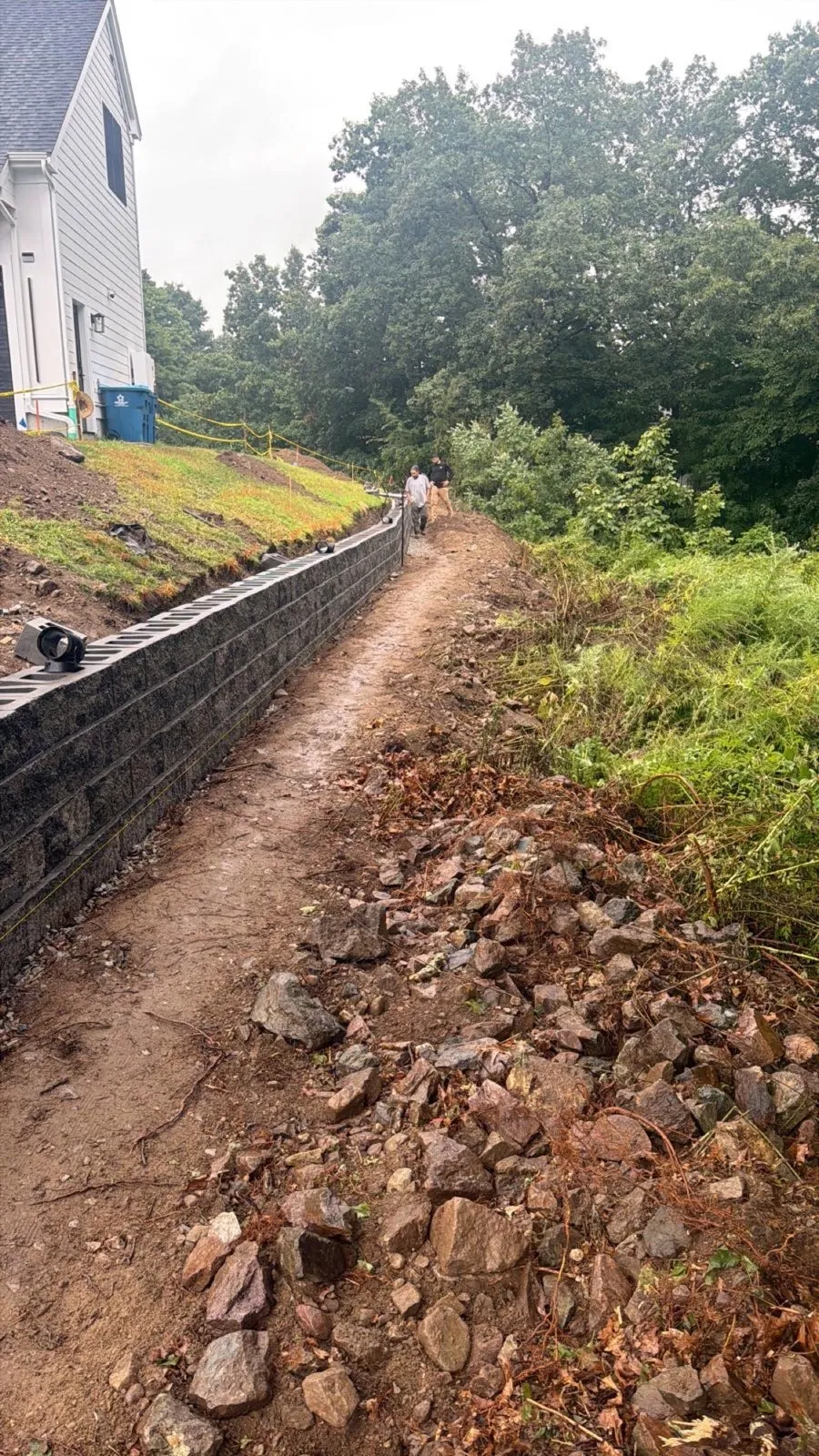 Completed retaining wall on a hillside in Massachusetts