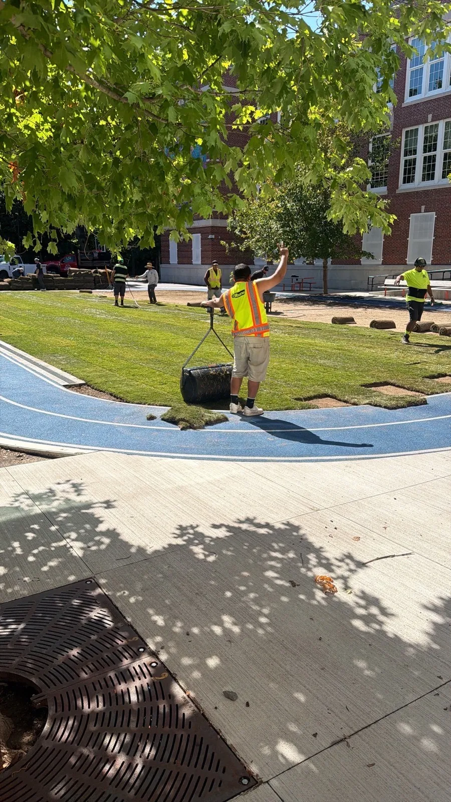 Casablanca crew installing sod on a school field in Boston, MA