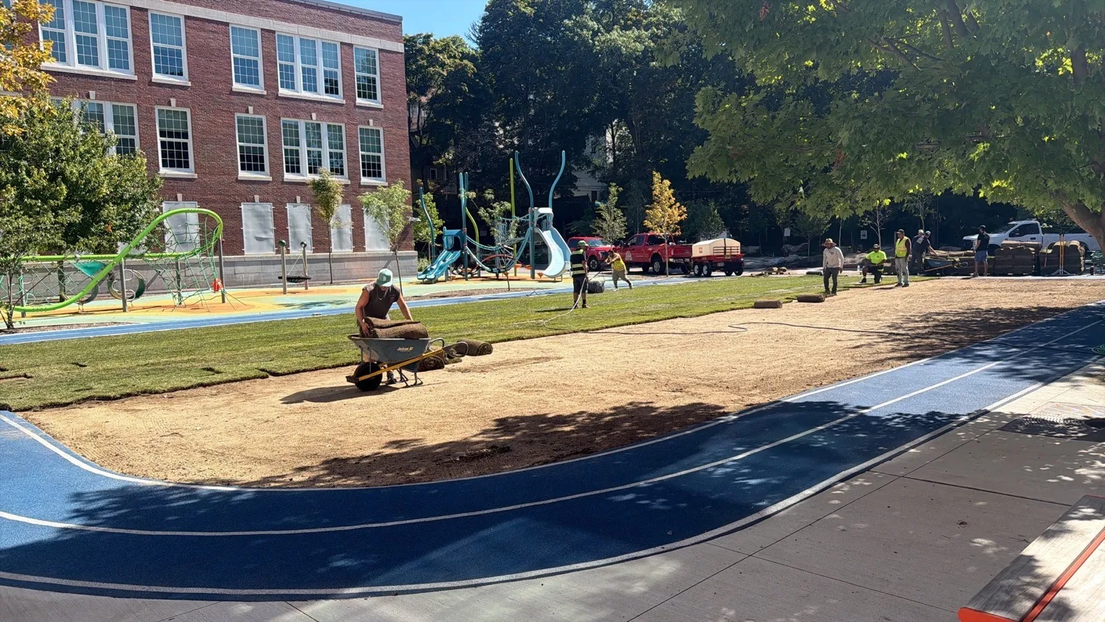 Sod rolls being installed on school grounds in Boston, MA